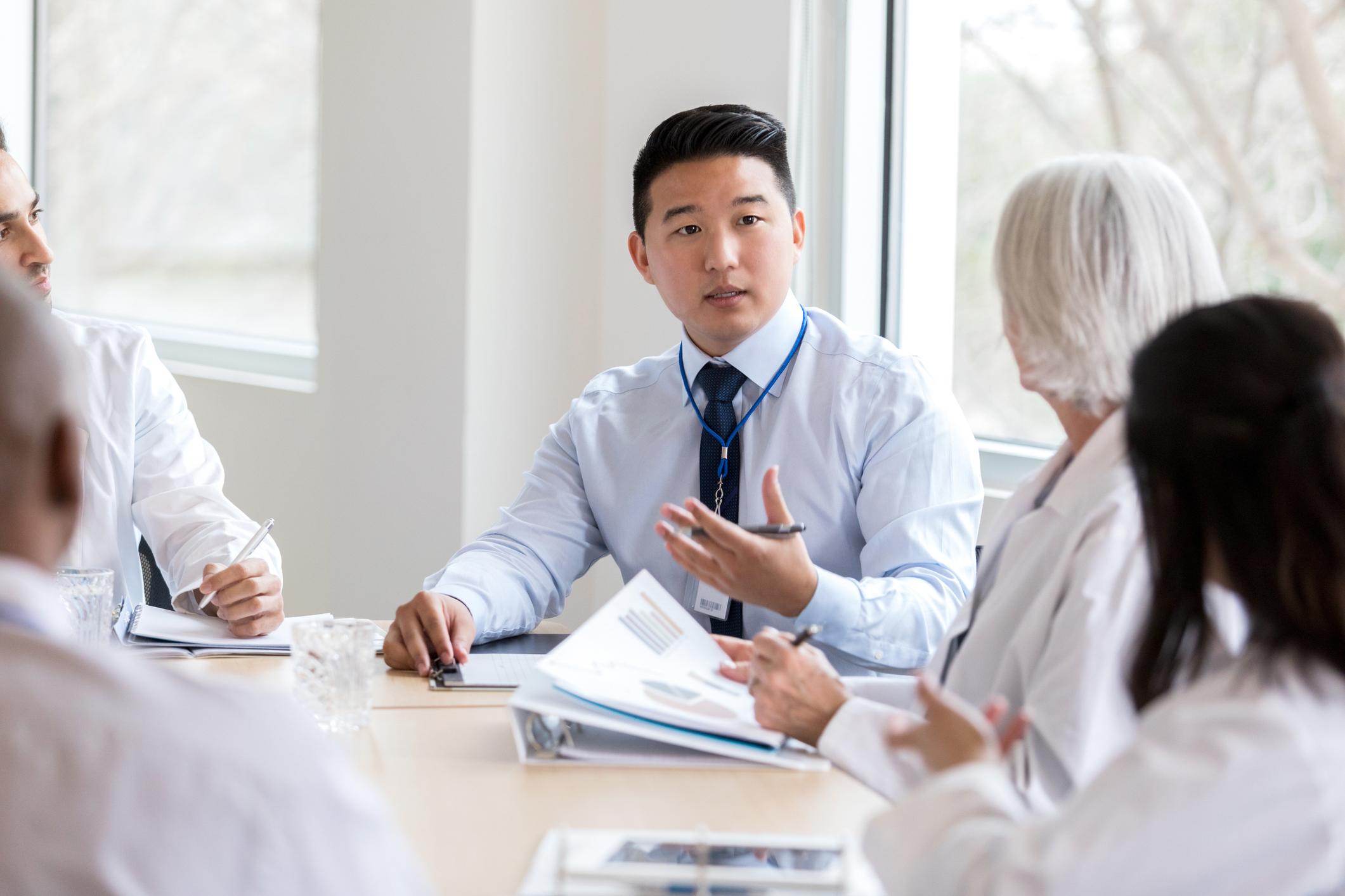 man talking to in meeting