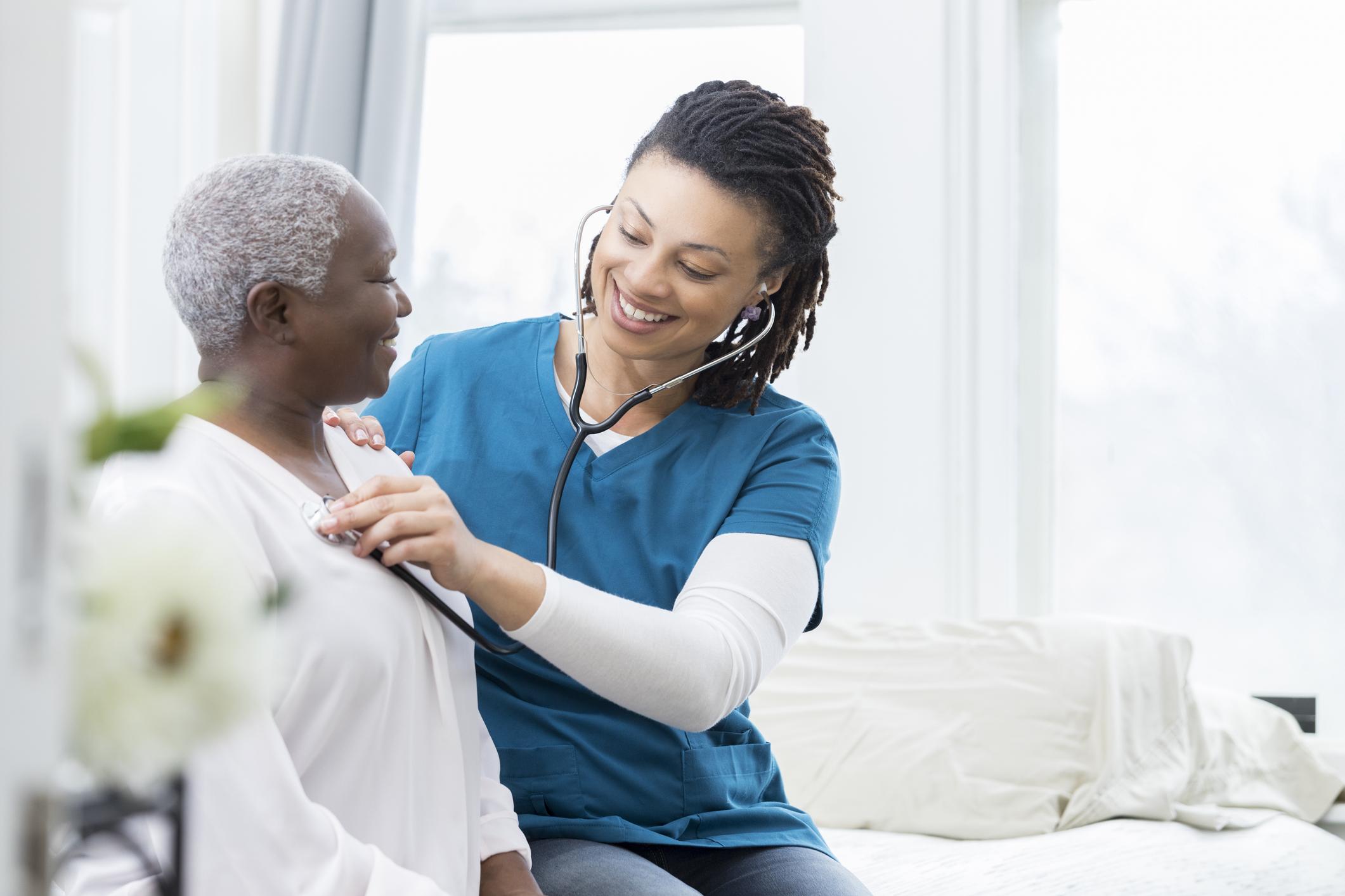 Nurse helping older patient